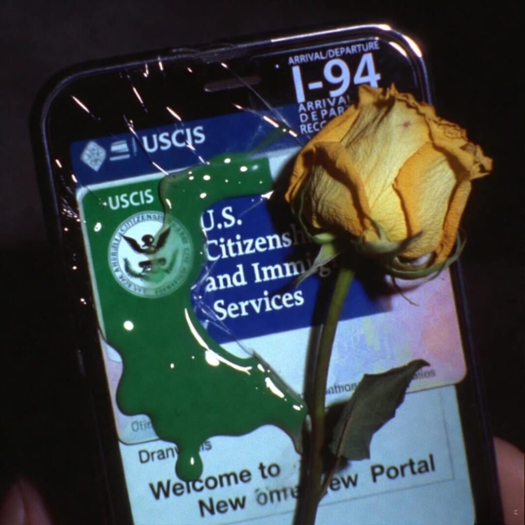 Melted green card on cracked USCIS phone